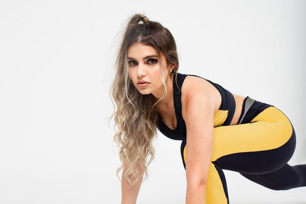 Person performing dynamic exercises in a modern studio